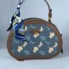 COACH Oval navy blue pattern handbag for women with brown leather Egypt