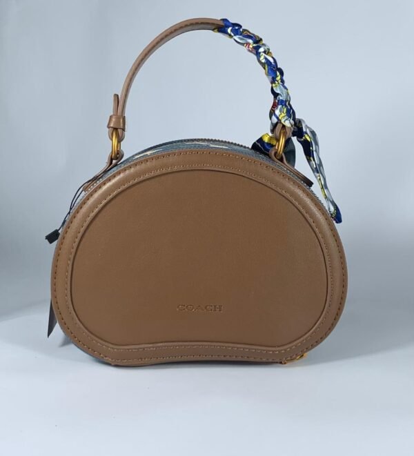 COACH Oval navy blue pattern handbag for women with brown leather Egypt