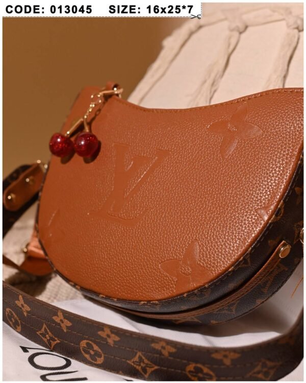 Brown leather shoulder bag for women with charm accessory Egypt