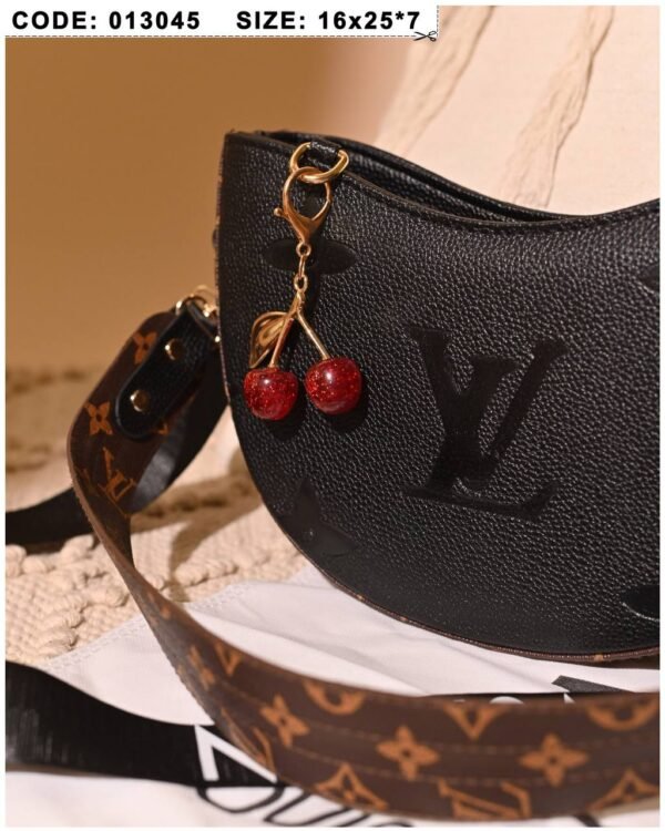 Black and brown leather shoulder bag for women with charm accessory Egypt