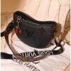Black and brown leather shoulder bag for women with charm accessory Egypt